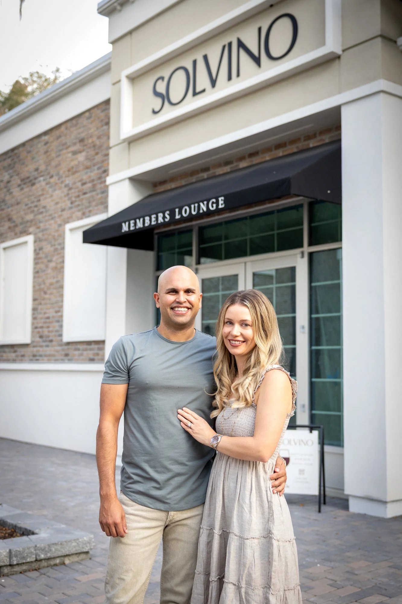 Solvino owners Arjun and Sara Kumar outside Solvino on Main Street in Windermere