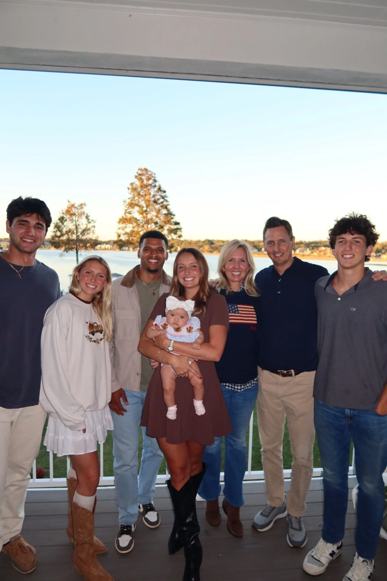 The McKissock family together on a lakeside deck