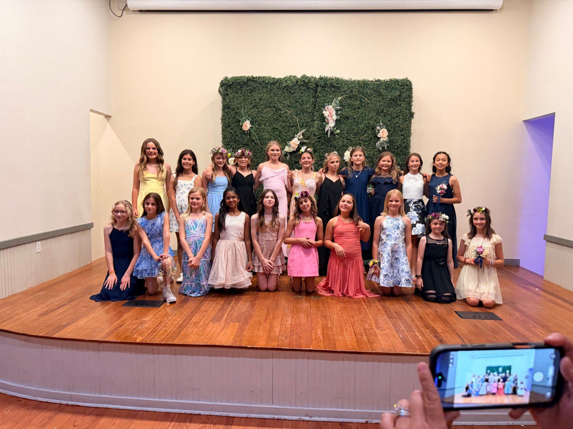 Daughters gather for a group photo at the Windermere Daddy Daughter Dance
