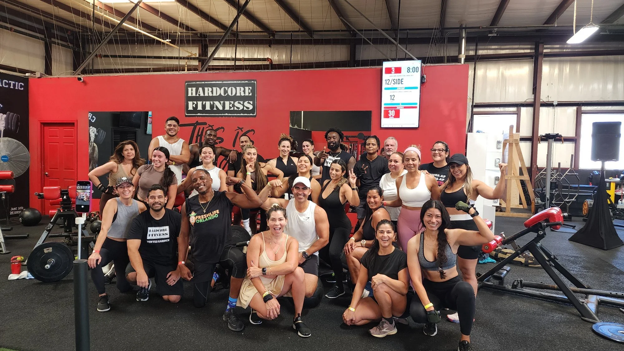 Felix Valentin with members of the Hardcore Fitness community at his studio