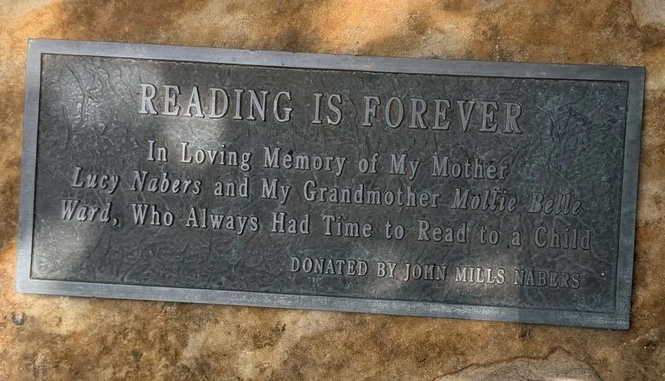 Reading Is Forever inscription beside the Summertime Read sculpture at the Windermere library