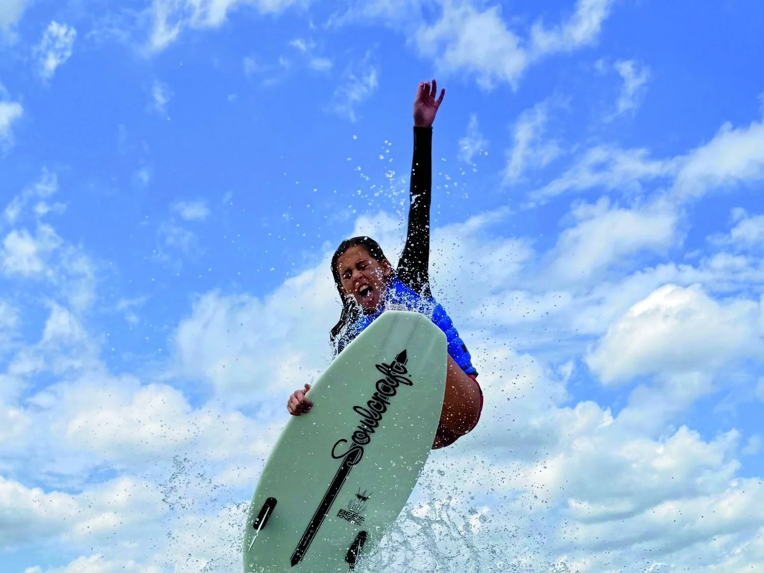 Windermere wakesurfer Beau Walters launches into the air off a boat wake under a blue sky