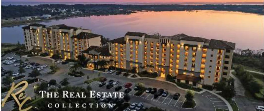 Lakefront condominium building at sunset in Central Florida, The Real Estate Collection