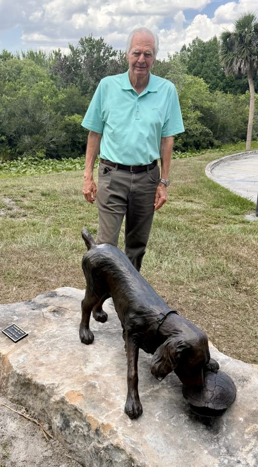 John Mills Nabers with the Anyone Home bronze of a retriever and turtle in Windermere