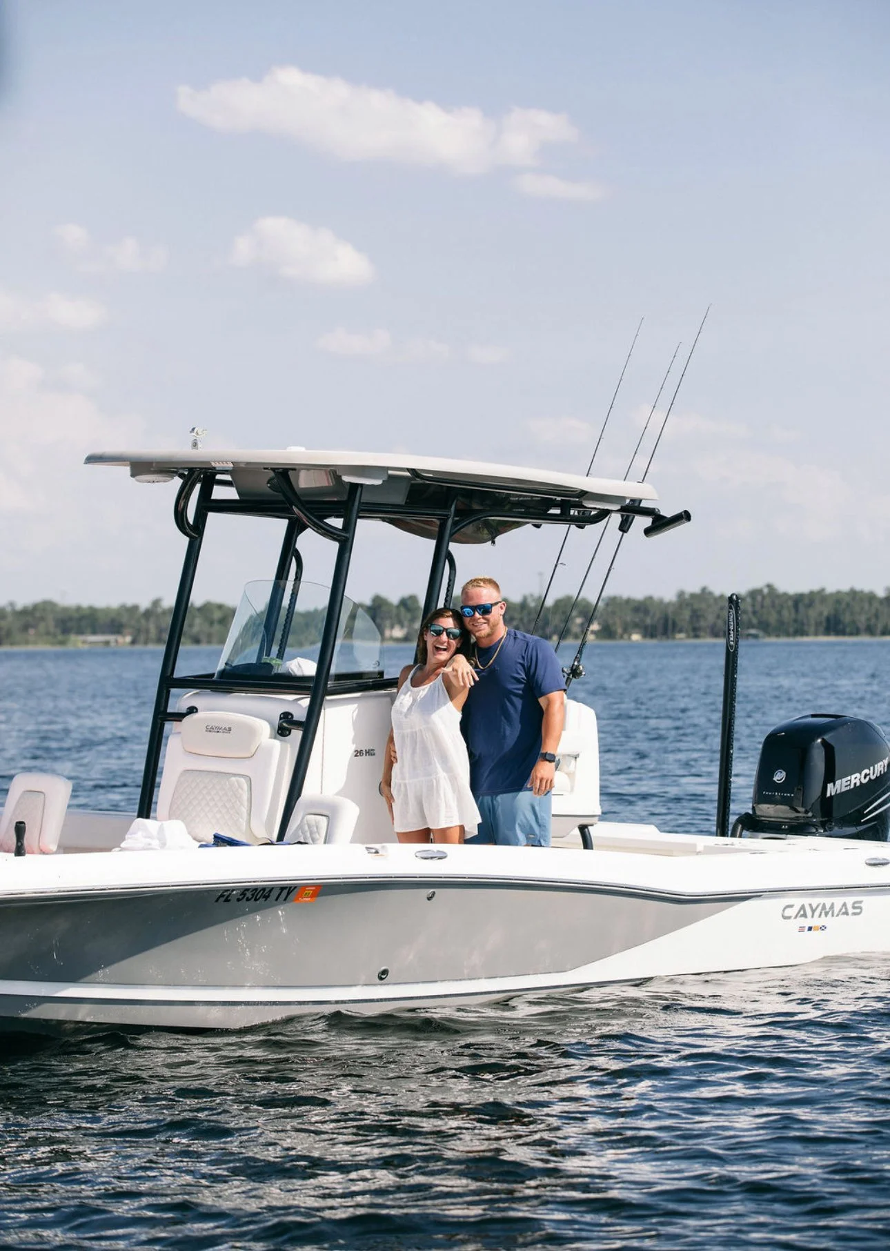 Kailey Sorenson and Kody Keller on a boat on the lake after their engagement