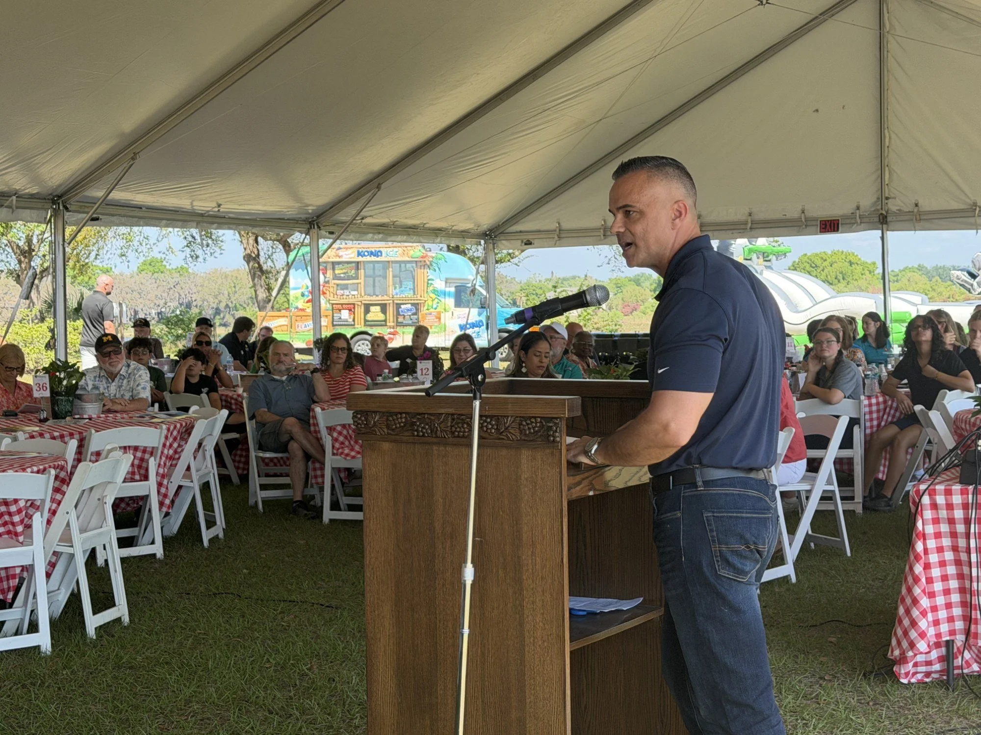 A speaker addresses supporters at the Edgewood Children’s Ranch Spring Picnic