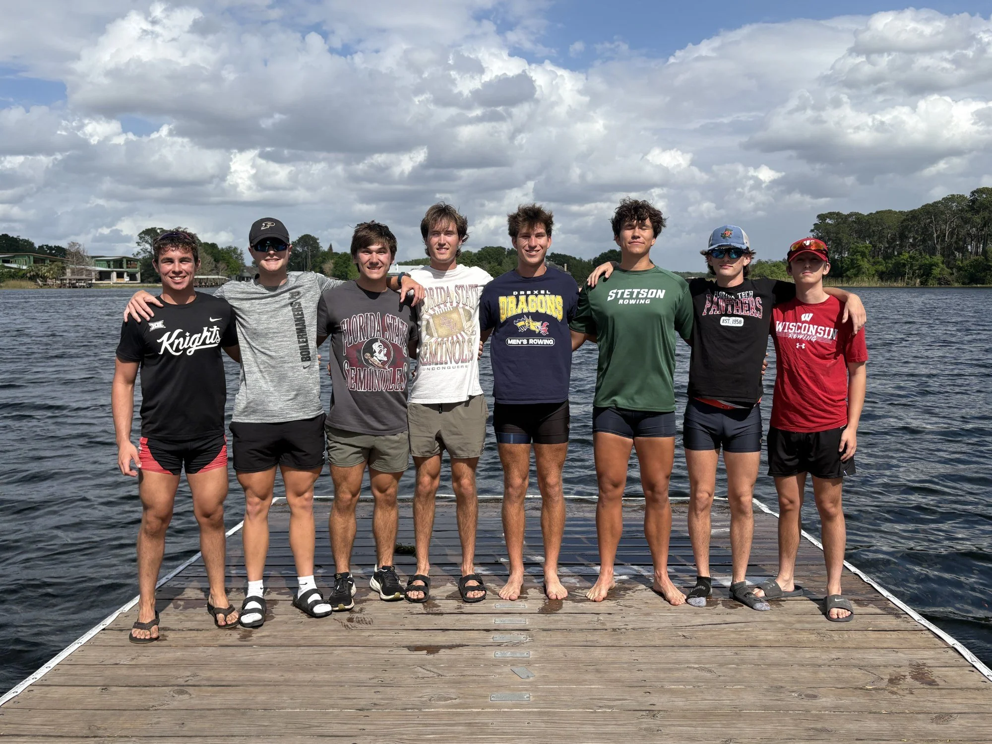 OARS senior rowers in their future college colors on the dock