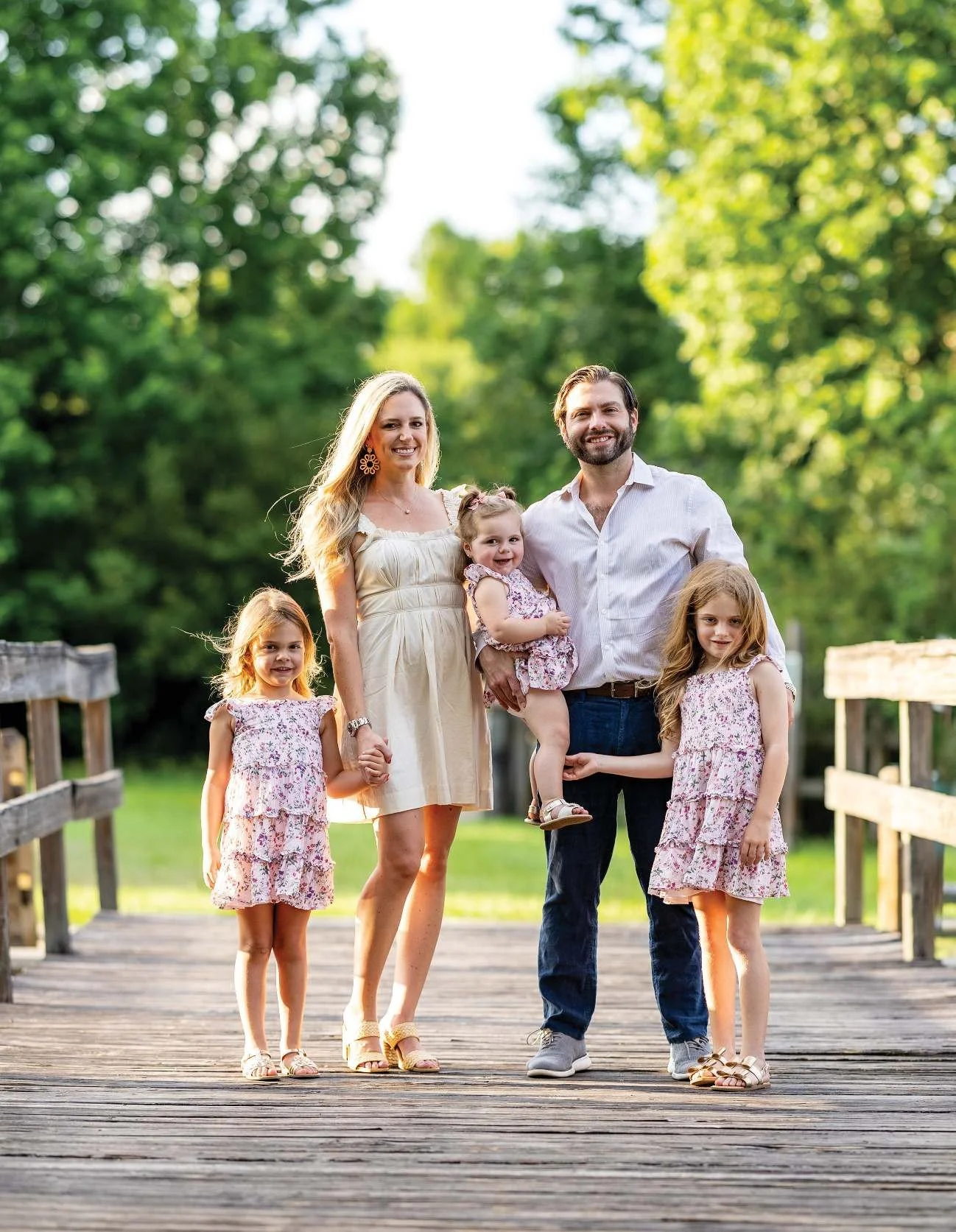 Keegan and Natalie Berry with their daughters Lily, Abigail and Amelia on a dock in Windermere