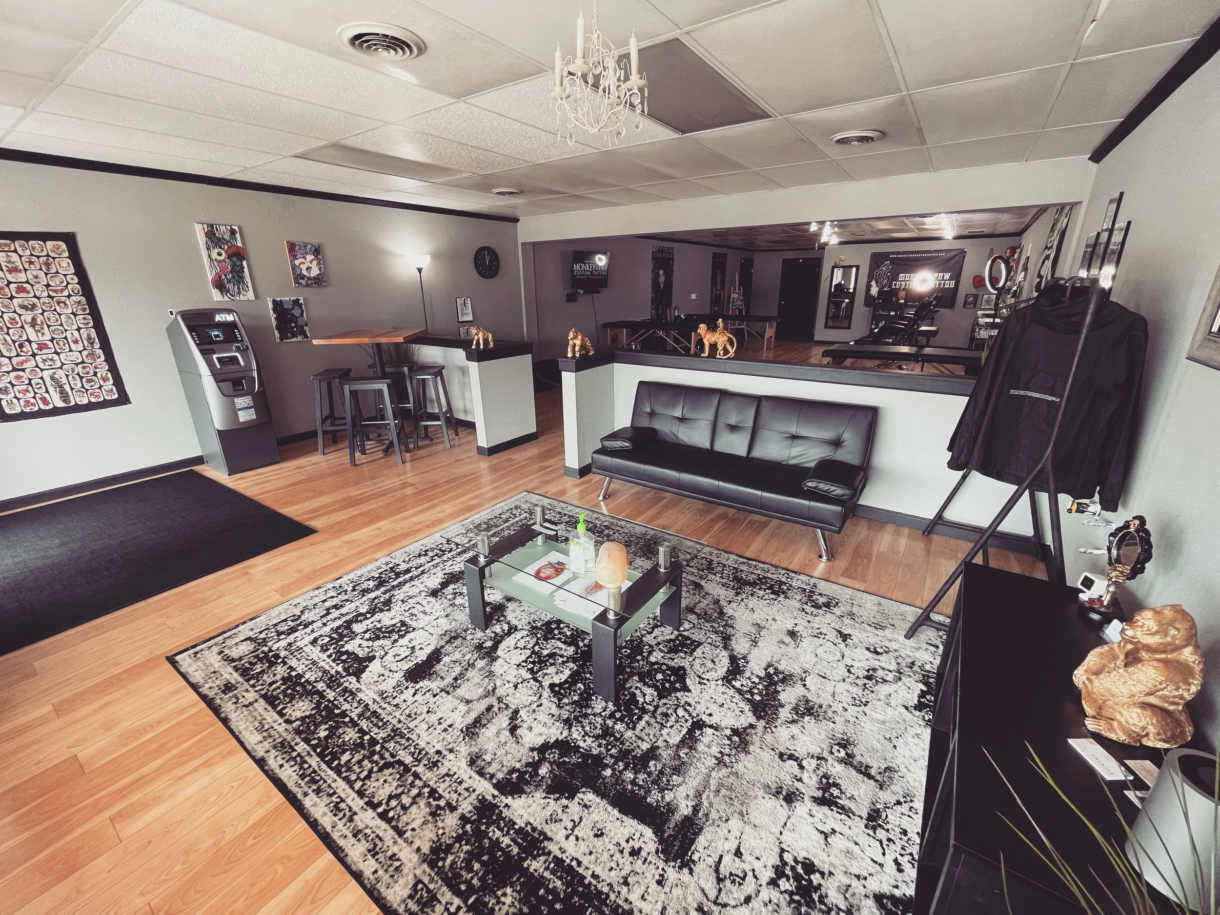 Inside image of tattoo shop showcases the waiting area outside the procedure area.