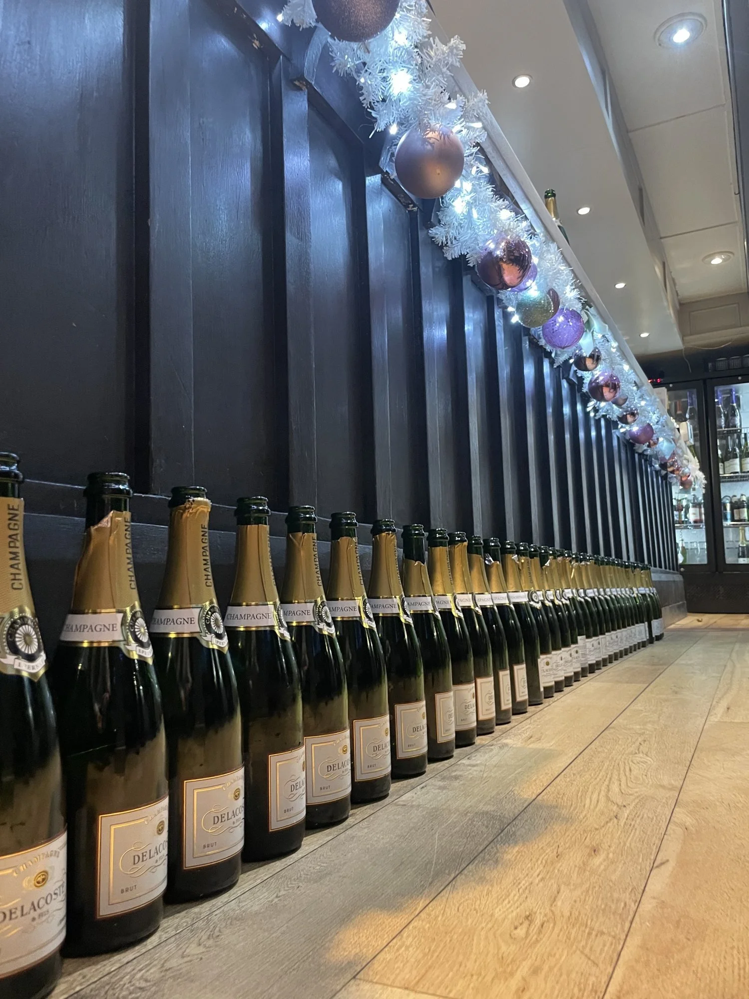 A row of champagne bottles.jpg