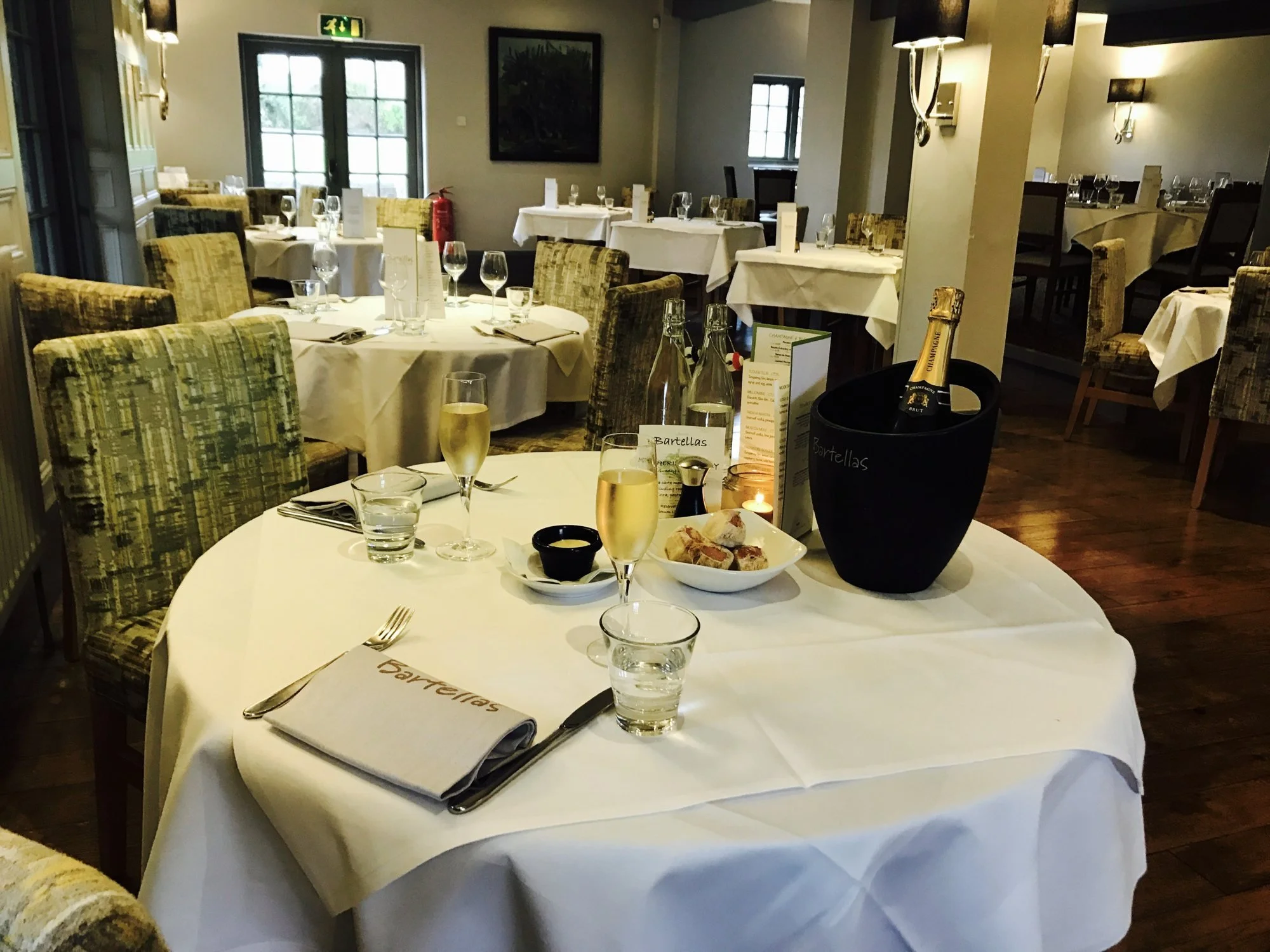 Champagne on ice at a table in the dining room.jpg
