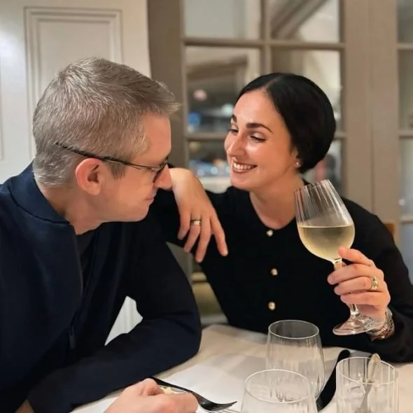 Guests sharing a glass of white wine.jpg
