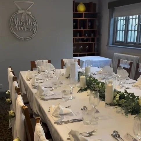 A long table laid for a celebration.jpg