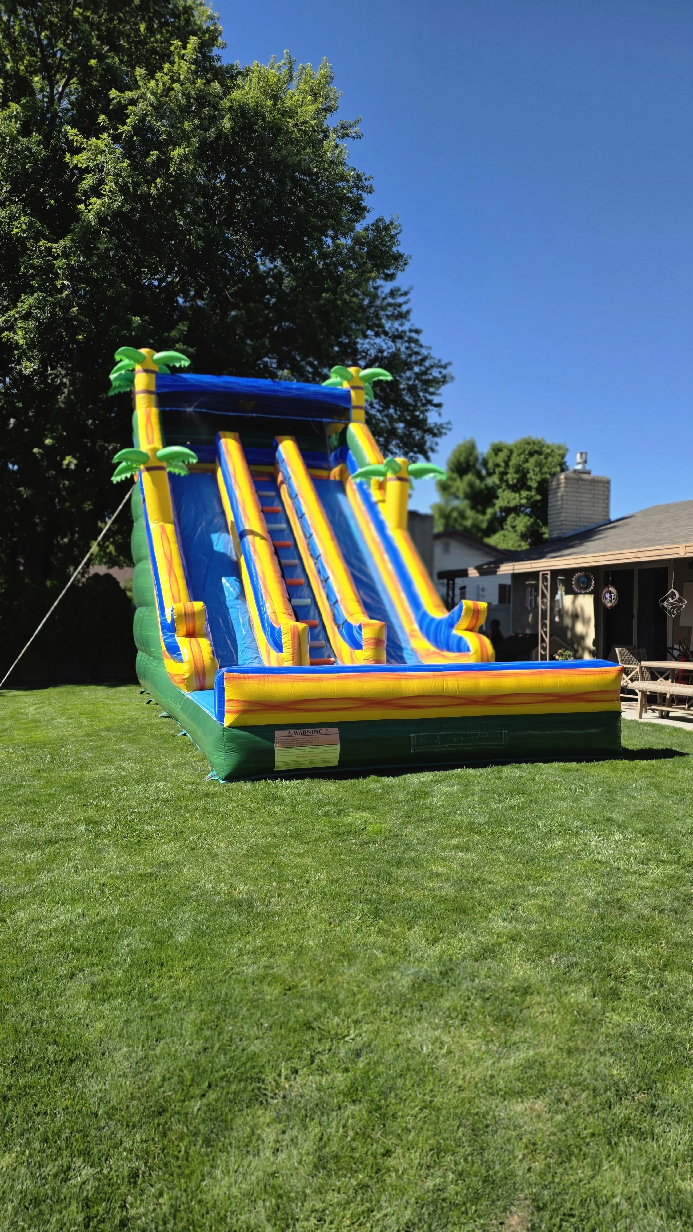 Extra-large Pompeii tropical waterslide set up in a backyard, available for rent in Richland, Kennewick, Pasco and surrounding Tri-Cities communities.
