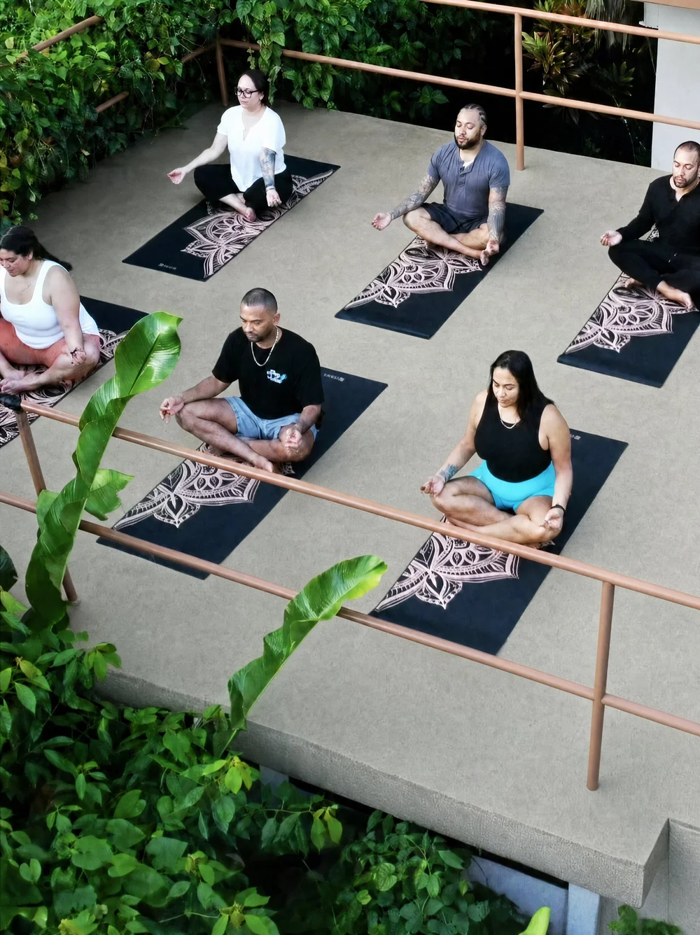 Guests practising yoga on the open-air deck at Casa Del Soul