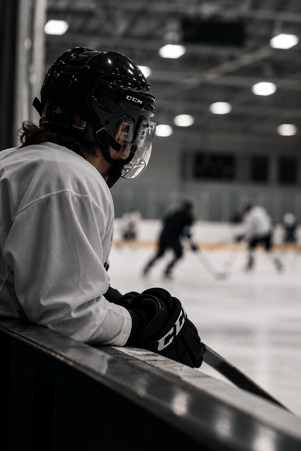 Focused Hockey Player on the Bench.png