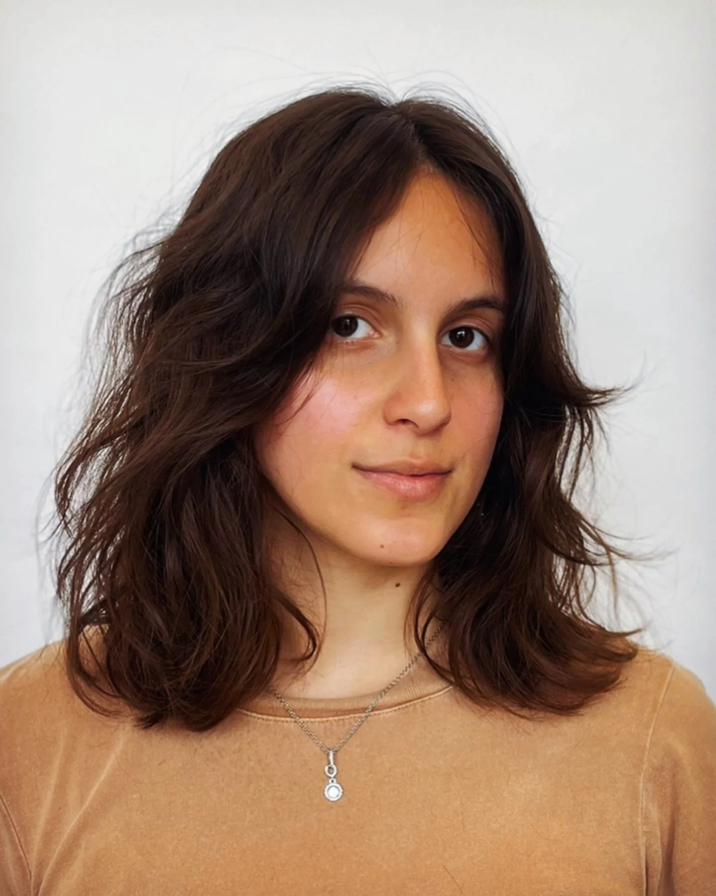 Medium-length layered haircut in Austin