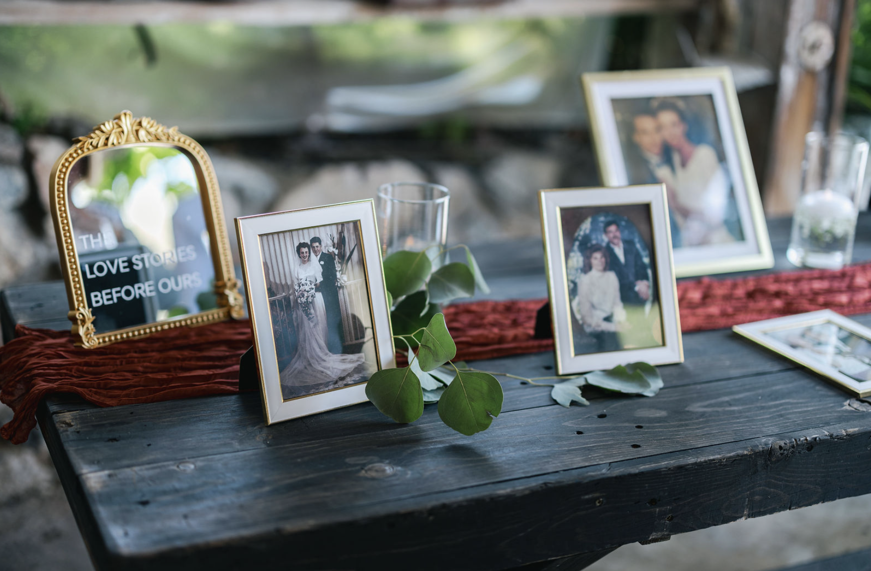 "Love Stories Before Ours" family photos honor table at Bernardo Winery.
