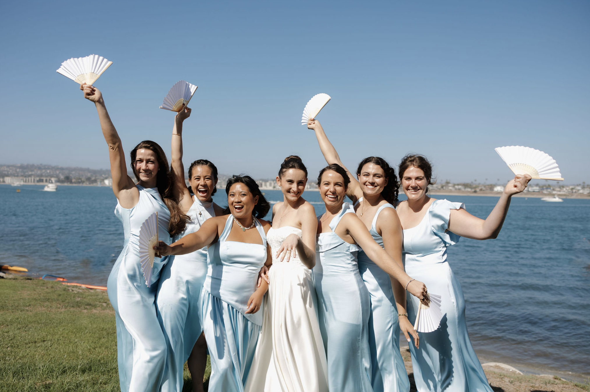 Beautiful bridal party celebrating on docks of Mission Bay Yacht Club.
