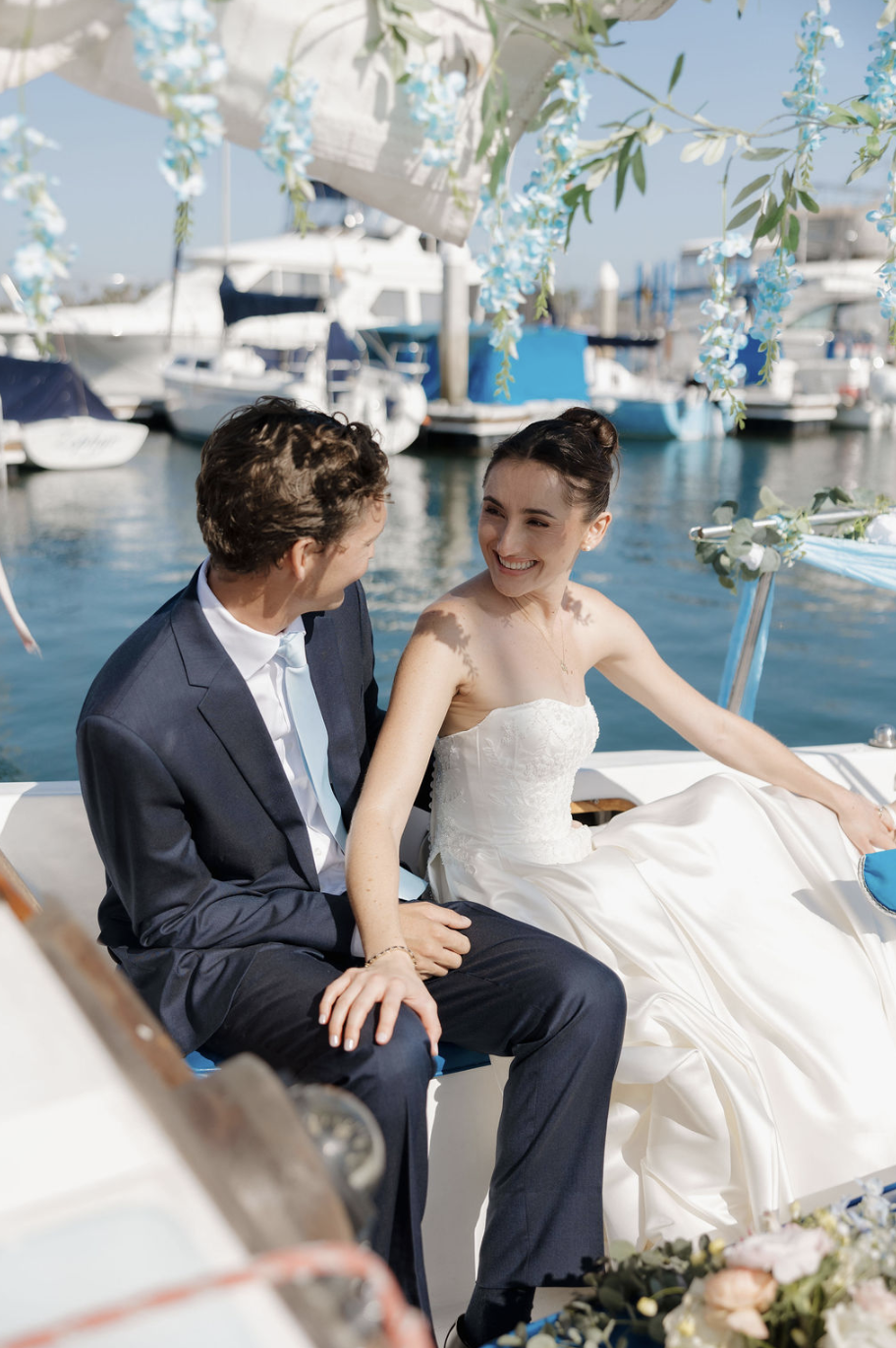 Grand entrance on  floral decorated vintage sail boat to Mission Bay Yacht Club. 