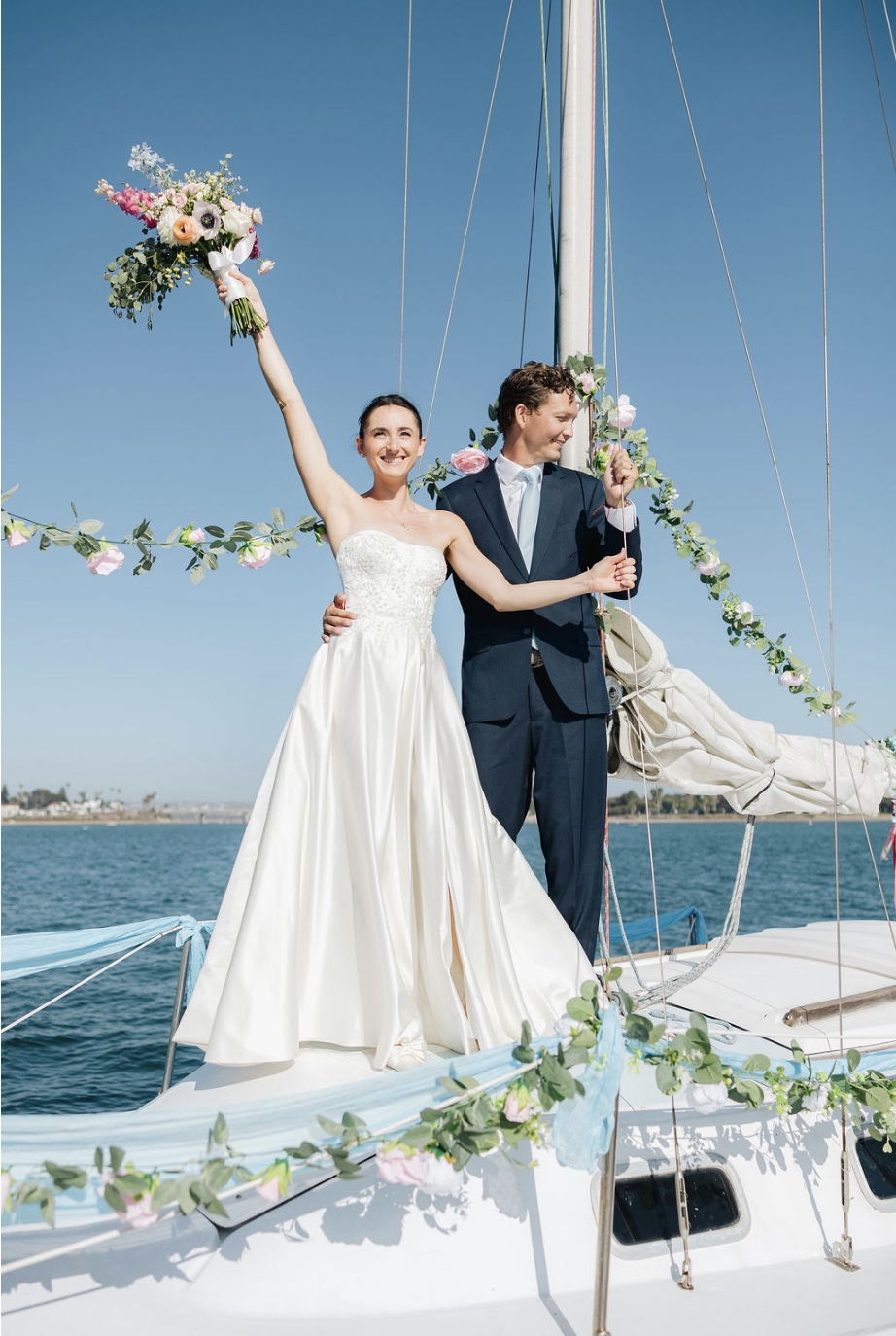 Grand entrance on  floral decorated vintage sail boat to Mission Bay Yacht Club. 