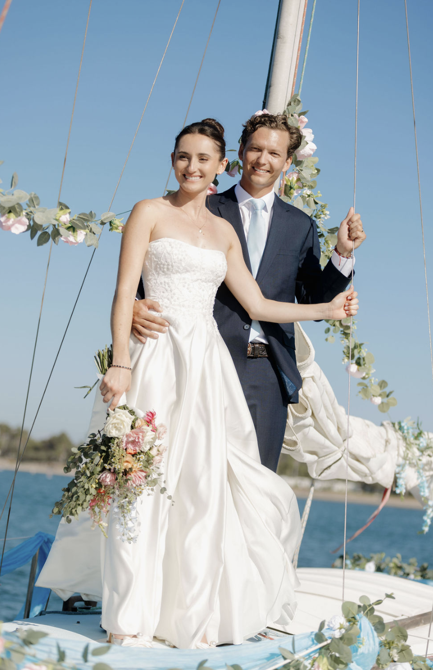Grand entrance on  floral decorated vintage sail boat to Mission Bay Yacht Club. 
