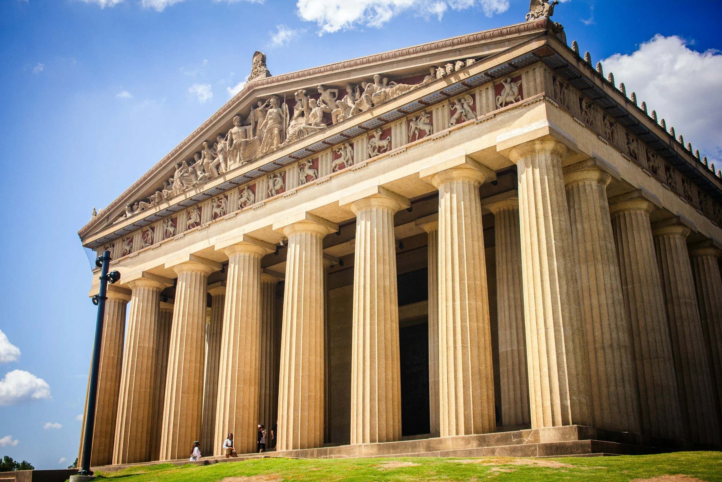The full-scale replica of the Parthenon in Nashville's Centennial Park under a blue sky