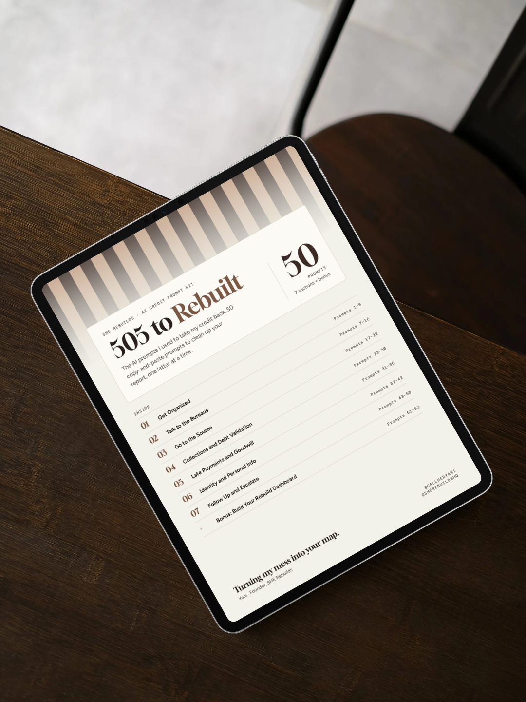 Tablet displaying the “505 to Rebuilt” credit repair prompt kit on a dark wooden table.