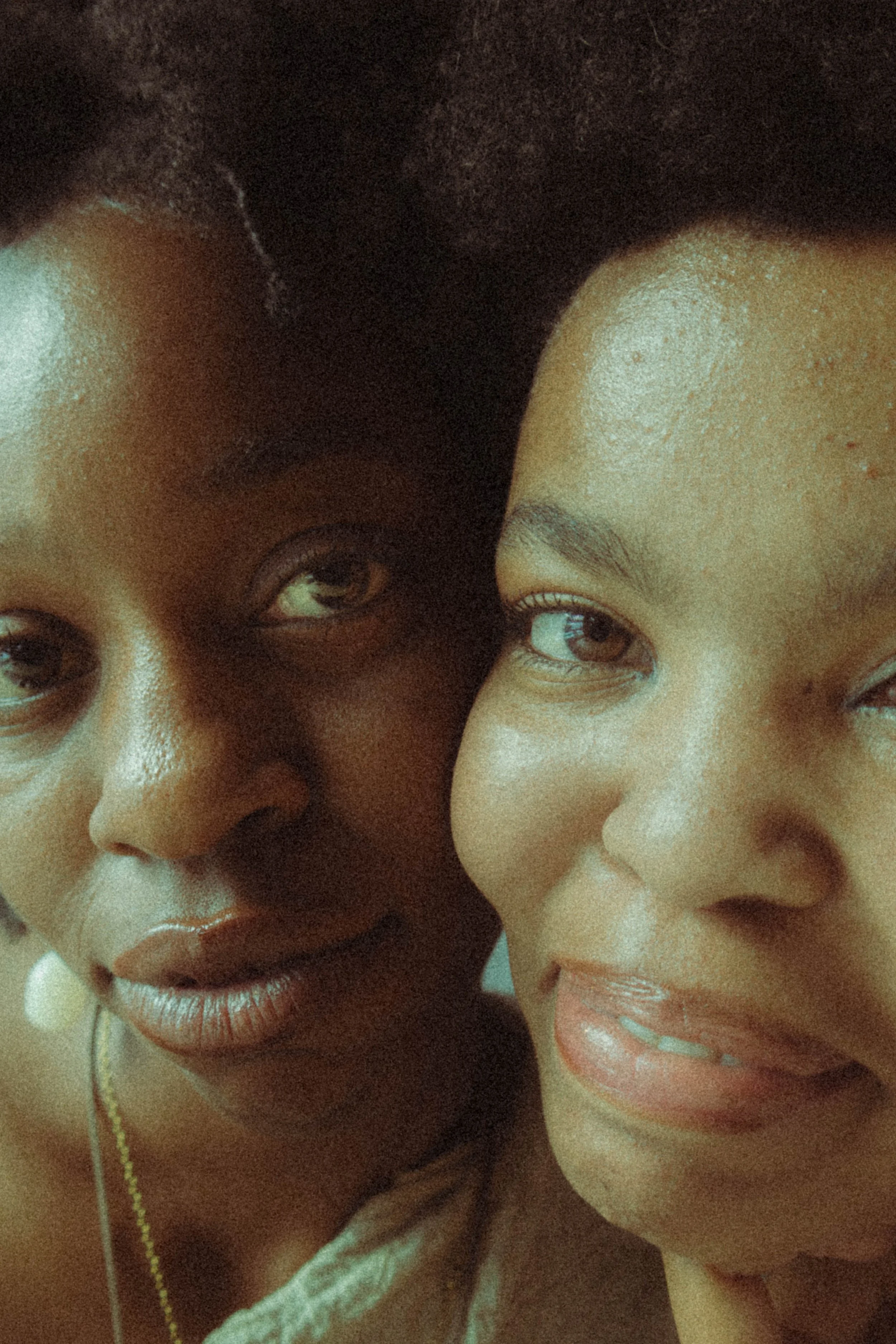 An editorial portrait photograph of two women looking staring at the camera taken by Kim Kambinda in Windhoek, Namibia.