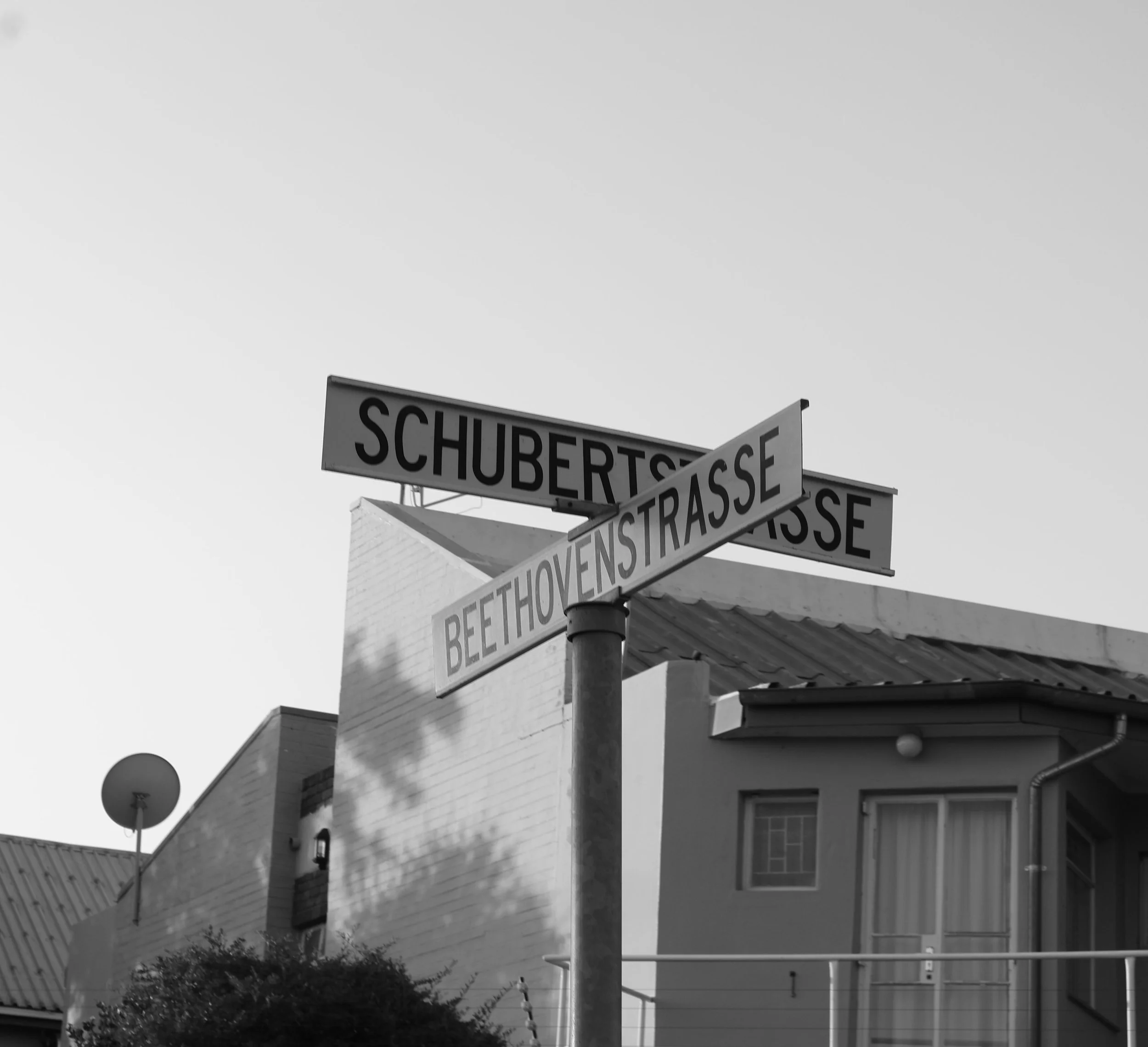 A black and white photograph of a street sign in Windhoek, Namibia taken by Kim Kambinda.