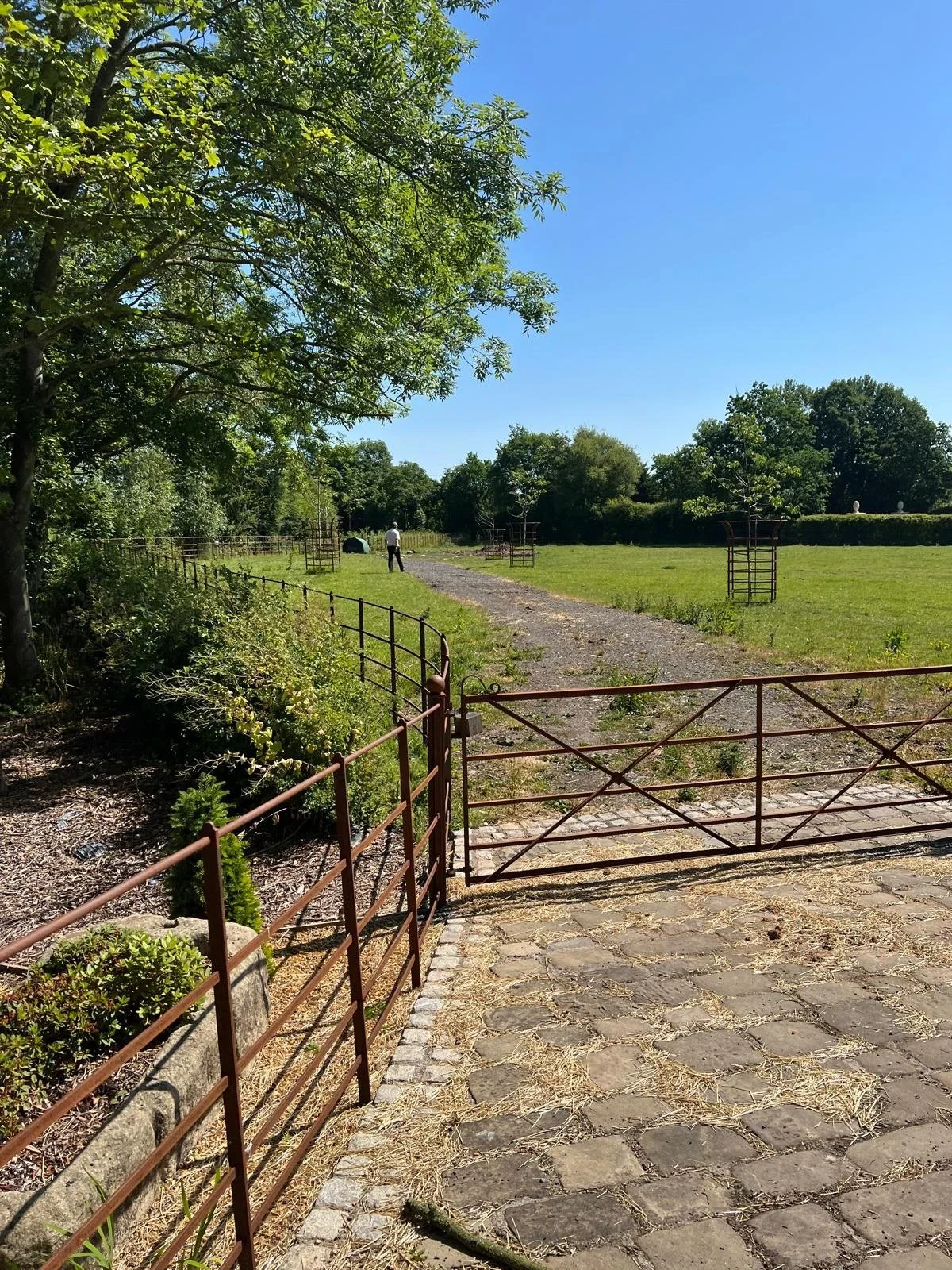 Steel estate field gate and railings installed at a farm track entrance