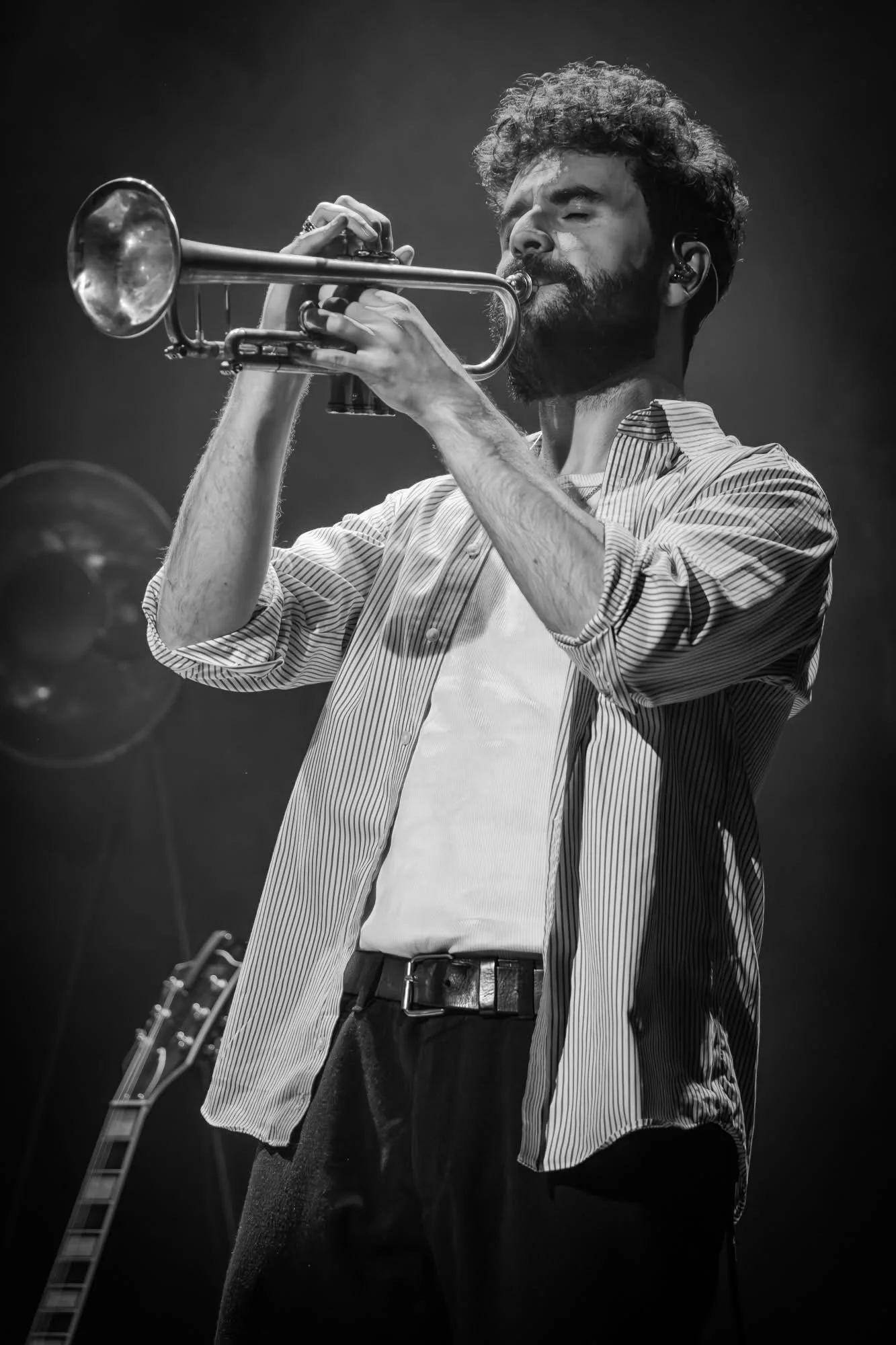 Black-and-white photo of a Samuel Freeman playing trumpet onstage
