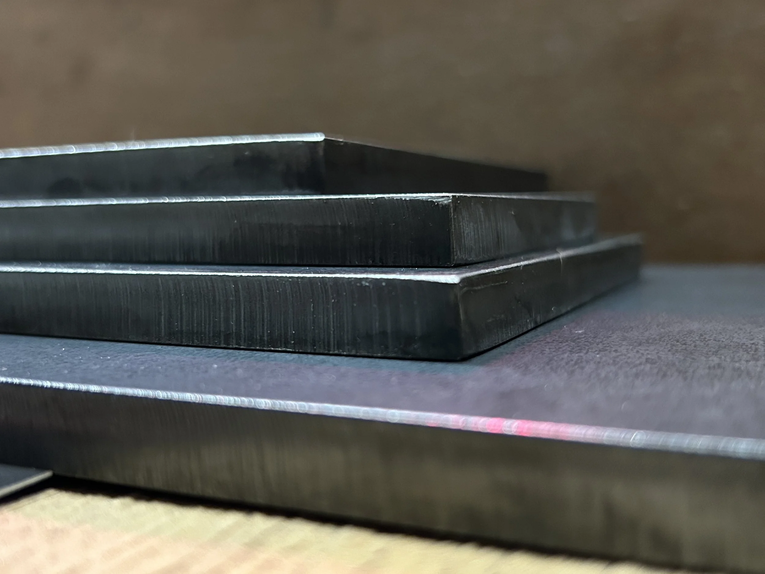 Close-up of CNC plasma cut mild steel plates showing clean cut edges, steel thickness and precision fabrication. (Copy) (Copy) (Copy) (Copy) (Copy)