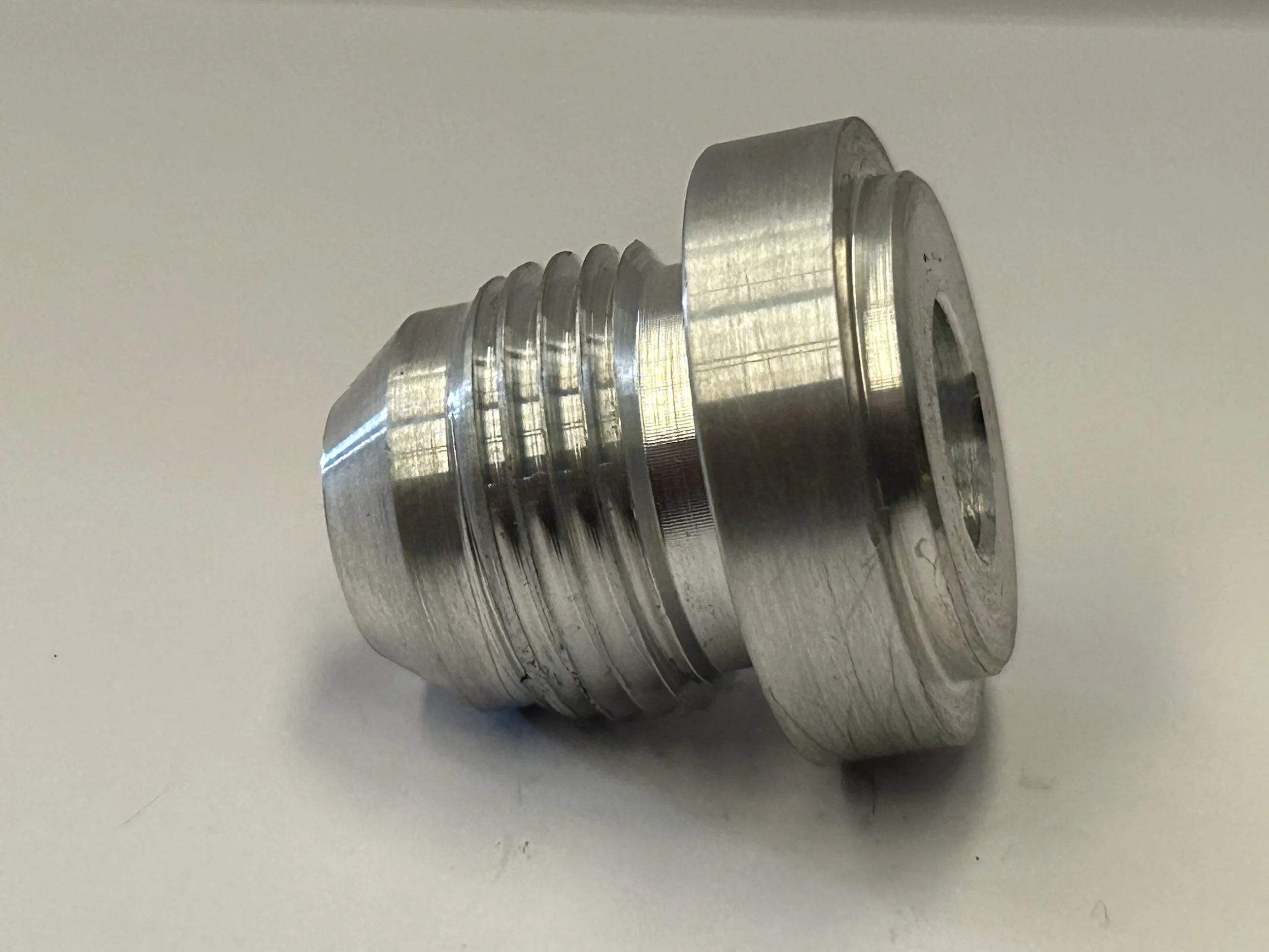 Side view of an AN-10 JIC male weld-on fitting CNC turned from 6082 T6 aluminium, showing the external thread, 37-degree cone and weld flange.