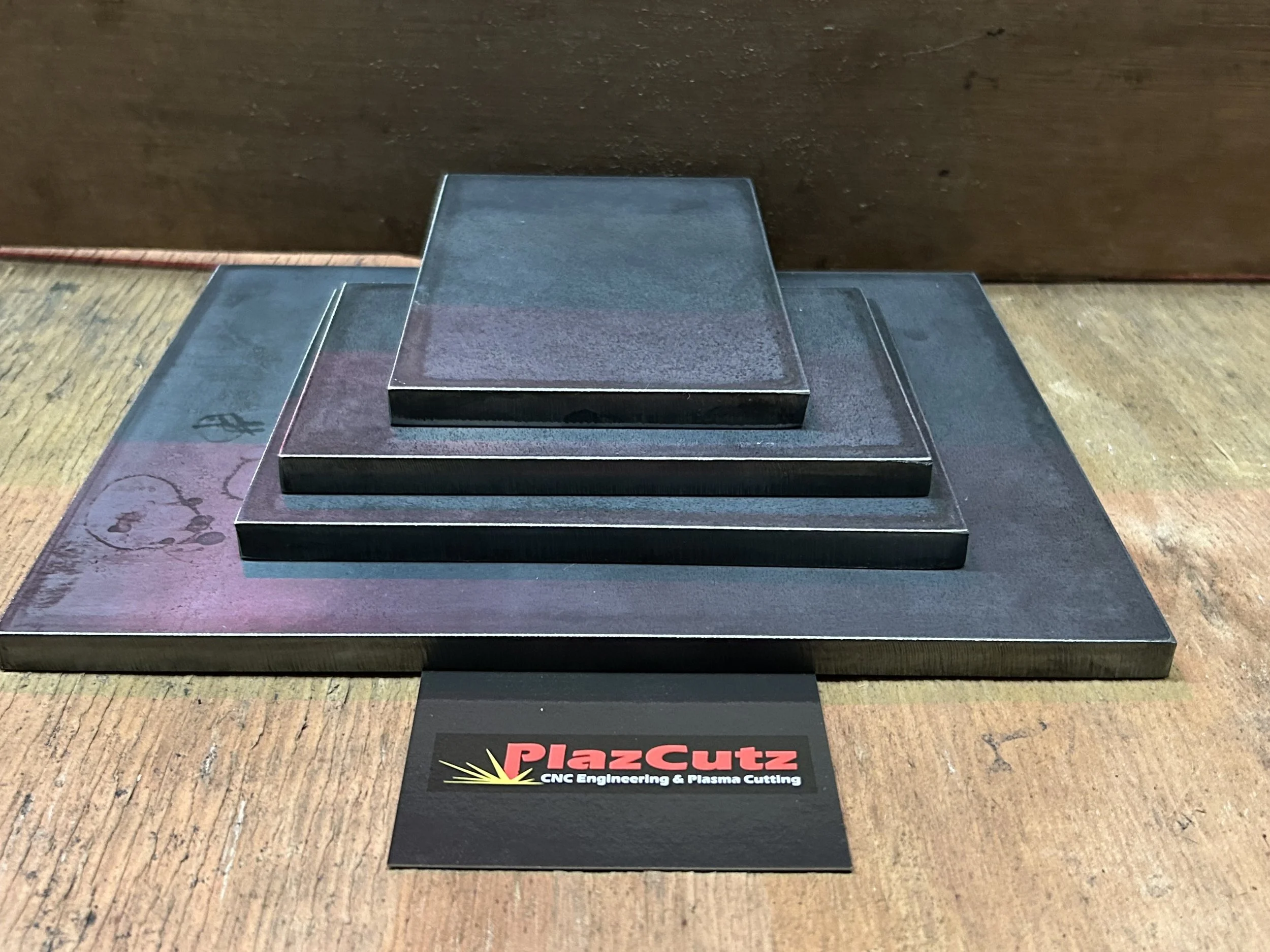 CNC plasma cut S275 mild steel plates stacked to show different sizes and thicknesses, manufactured by PlazCutz. (Copy) (Copy) (Copy) (Copy) (Copy)