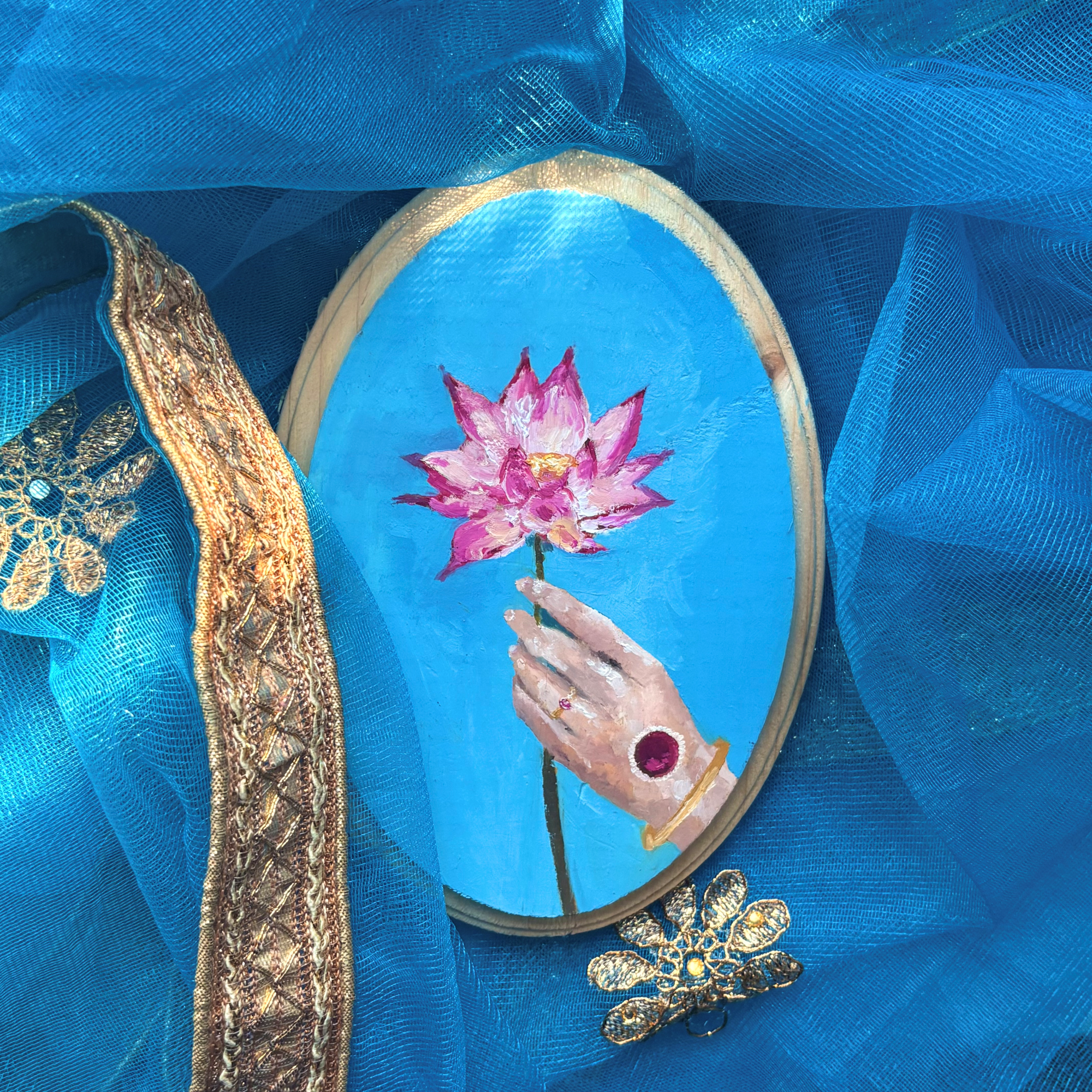 Hand holding a lotus flower