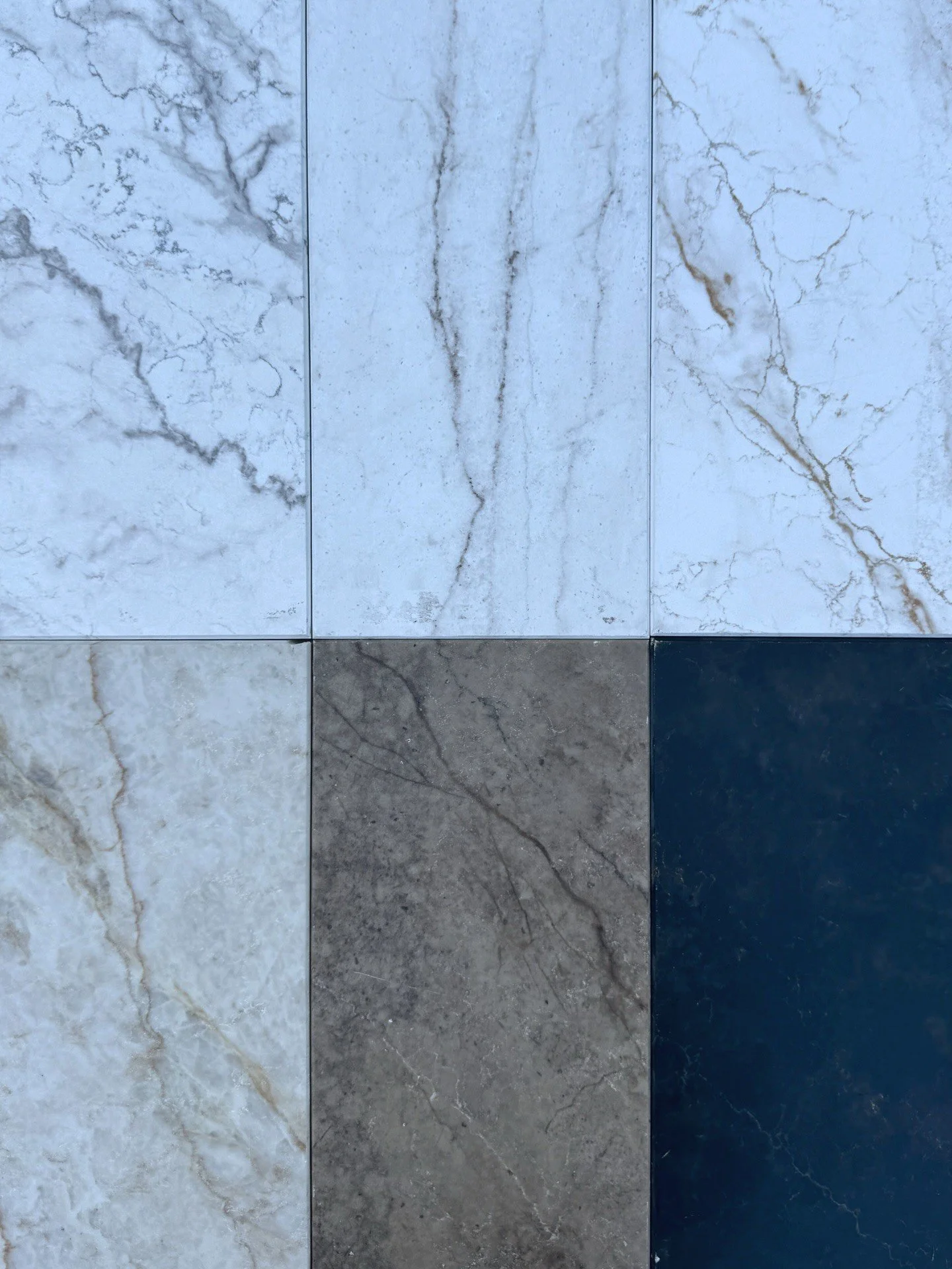 Coordinated slabs in pale gray charcoal and blue finishes