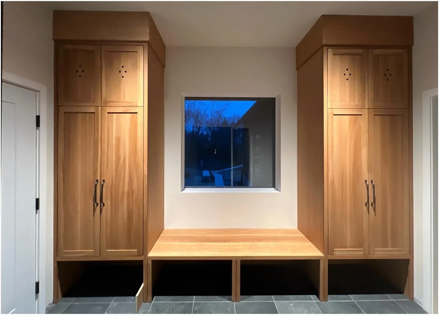Original pale wood built-ins surrounding an empty bench alcove