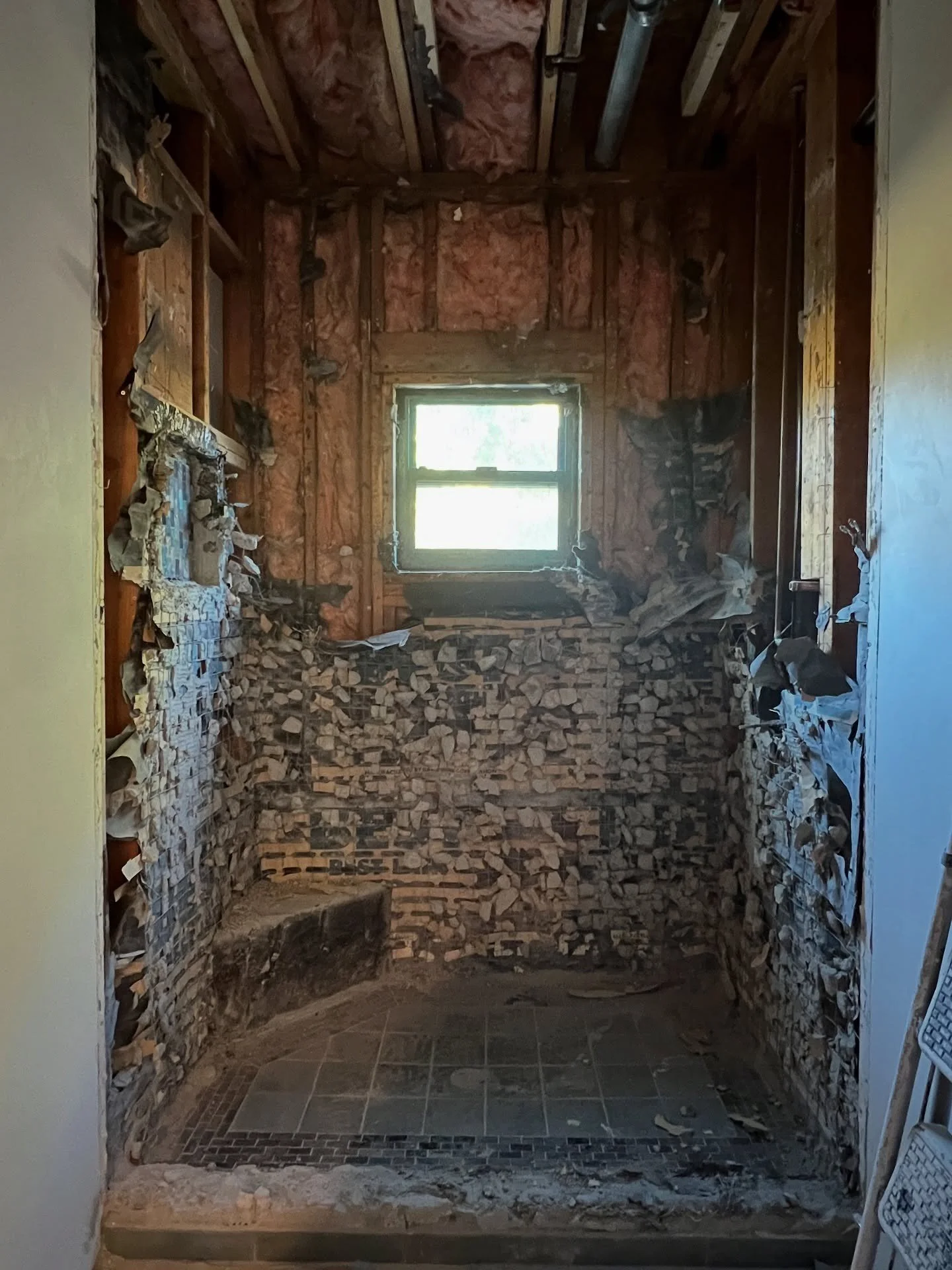 Bathroom stripped to studs during demolition