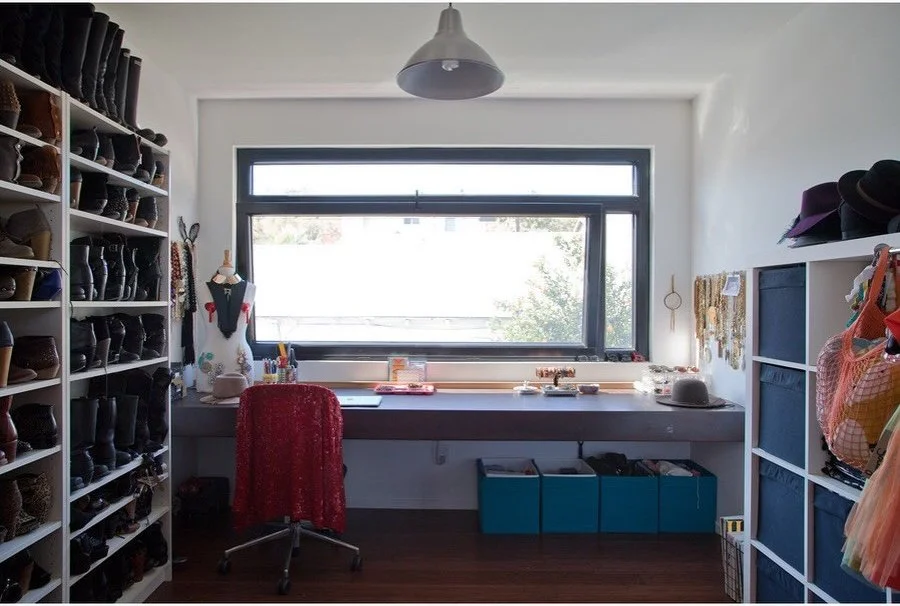 Bright dressing room with a desk beneath a wide window