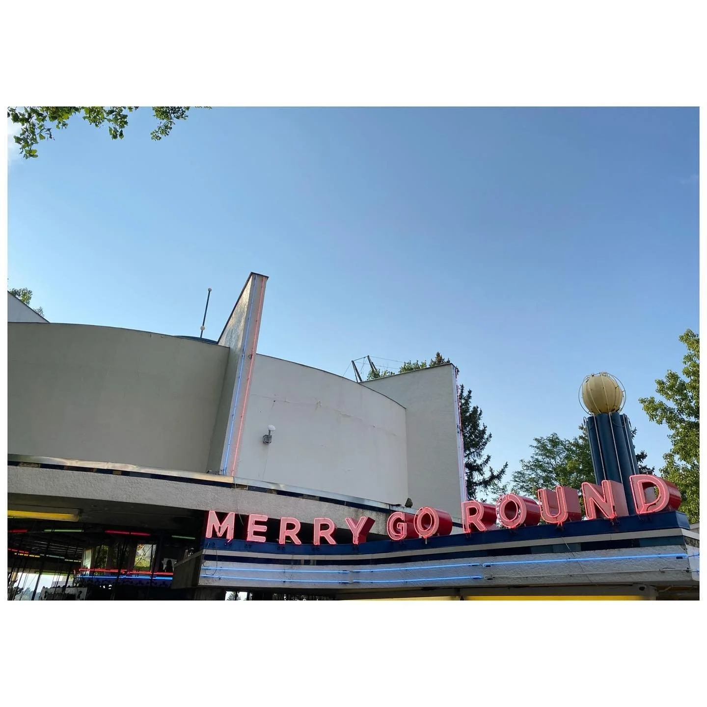 Vintage Merry-Go-Round lettering above an amusement park entrance