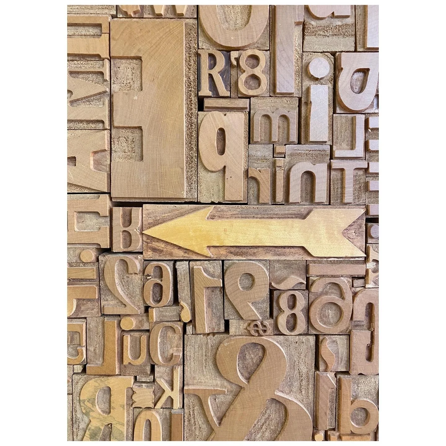 Collection of carved timber letters, numerals and symbols used for printing
