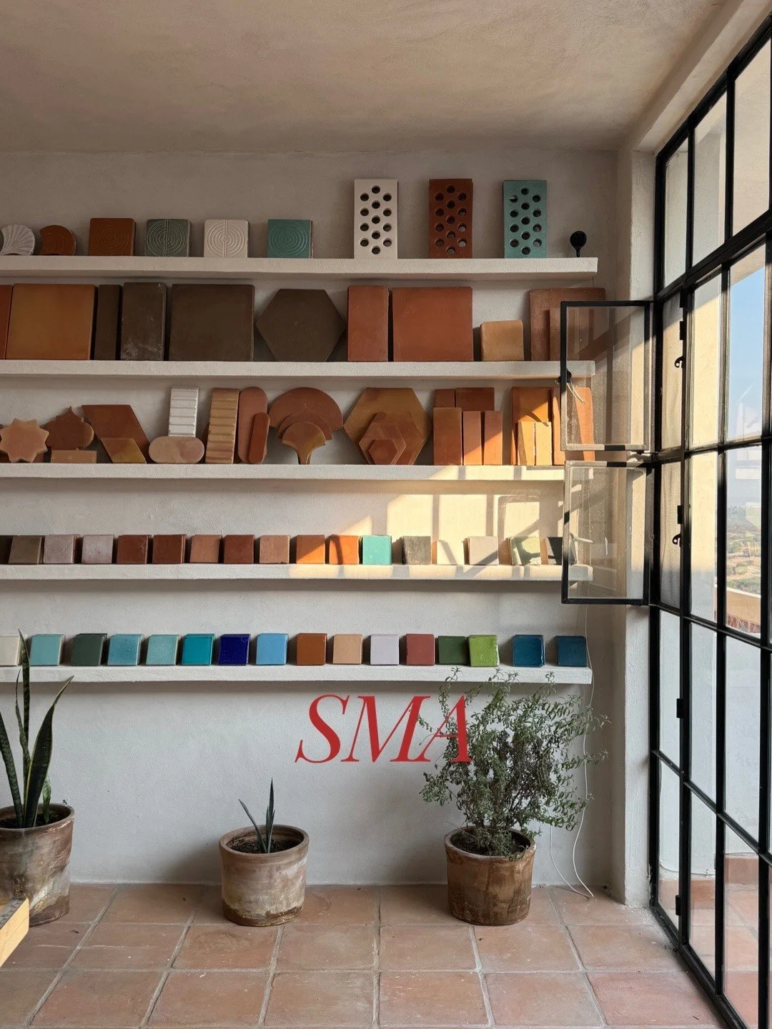Showroom wall displaying colorful tile and ceramic samples