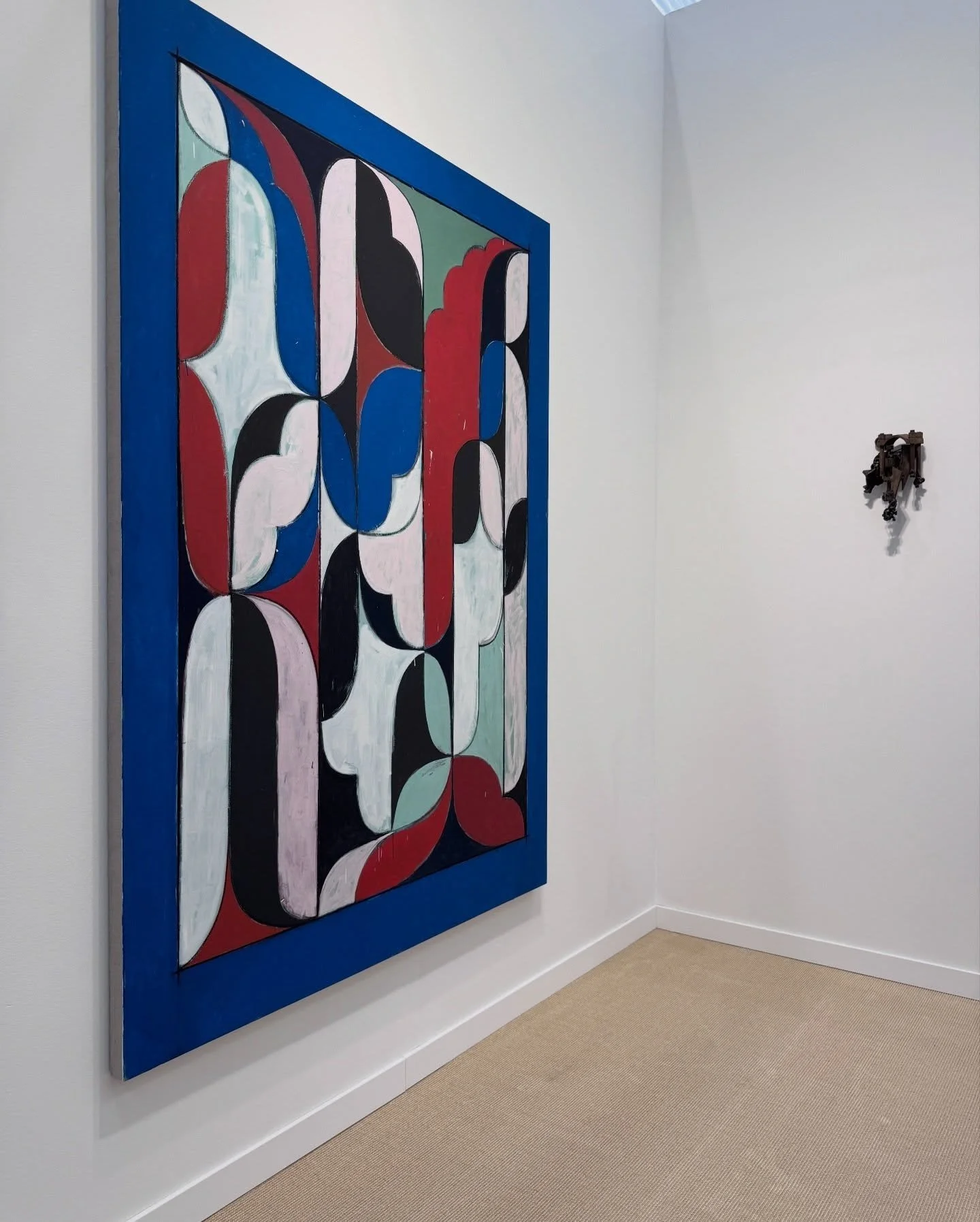 Geometric painting in red, blue, white and black
