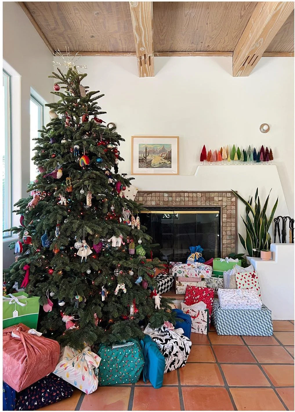 Daylight view of a decorated Christmas tree under exposed wood beams
