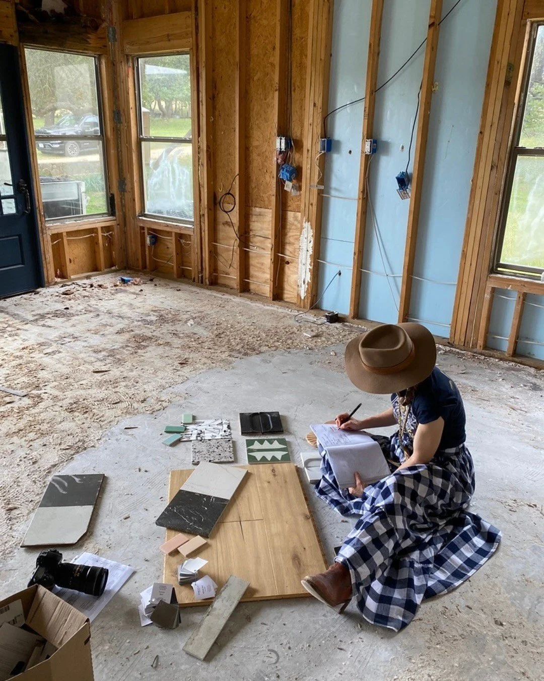 Designer reviewing material samples on a renovation site