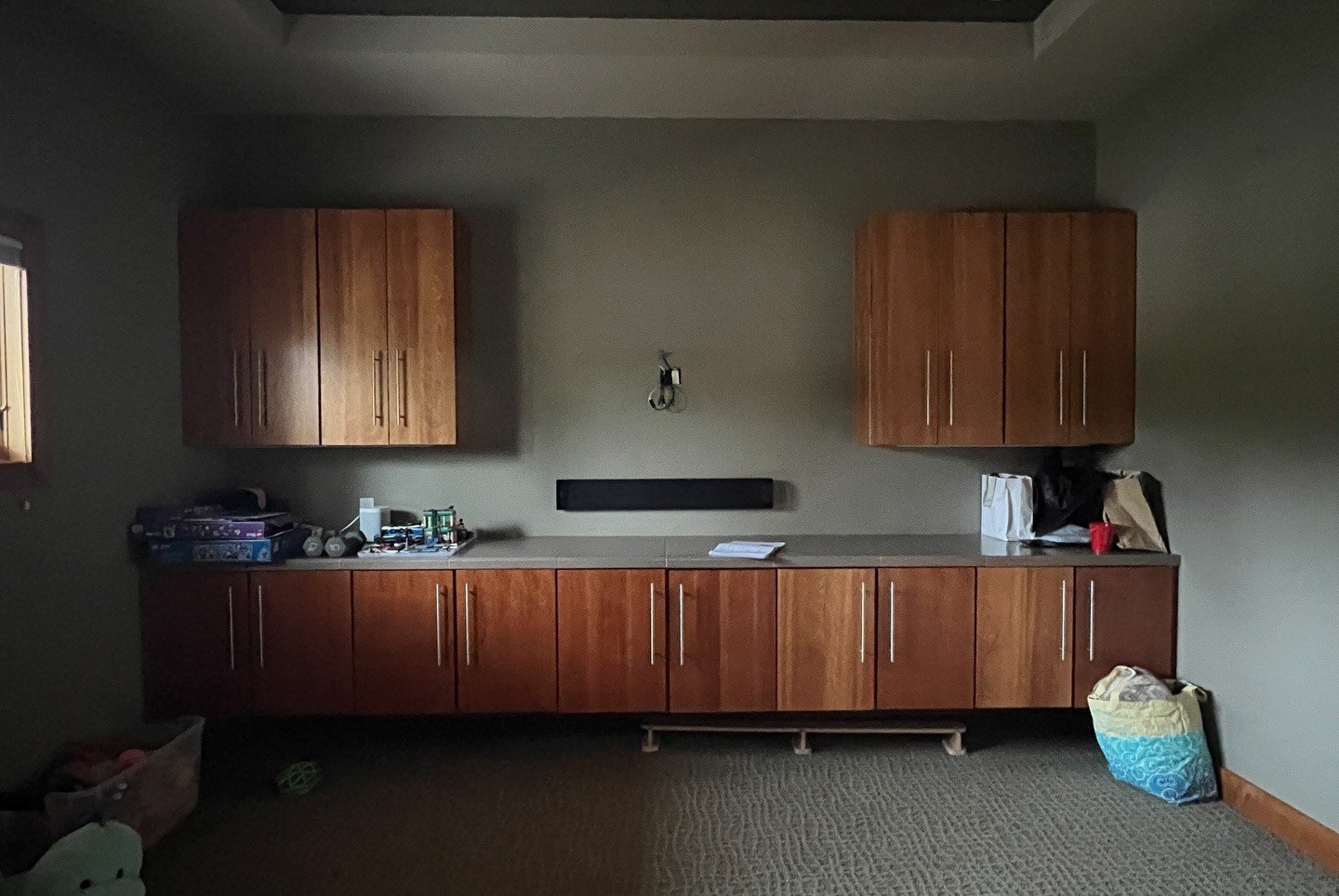 Original dark room with wood cabinets and a counter
