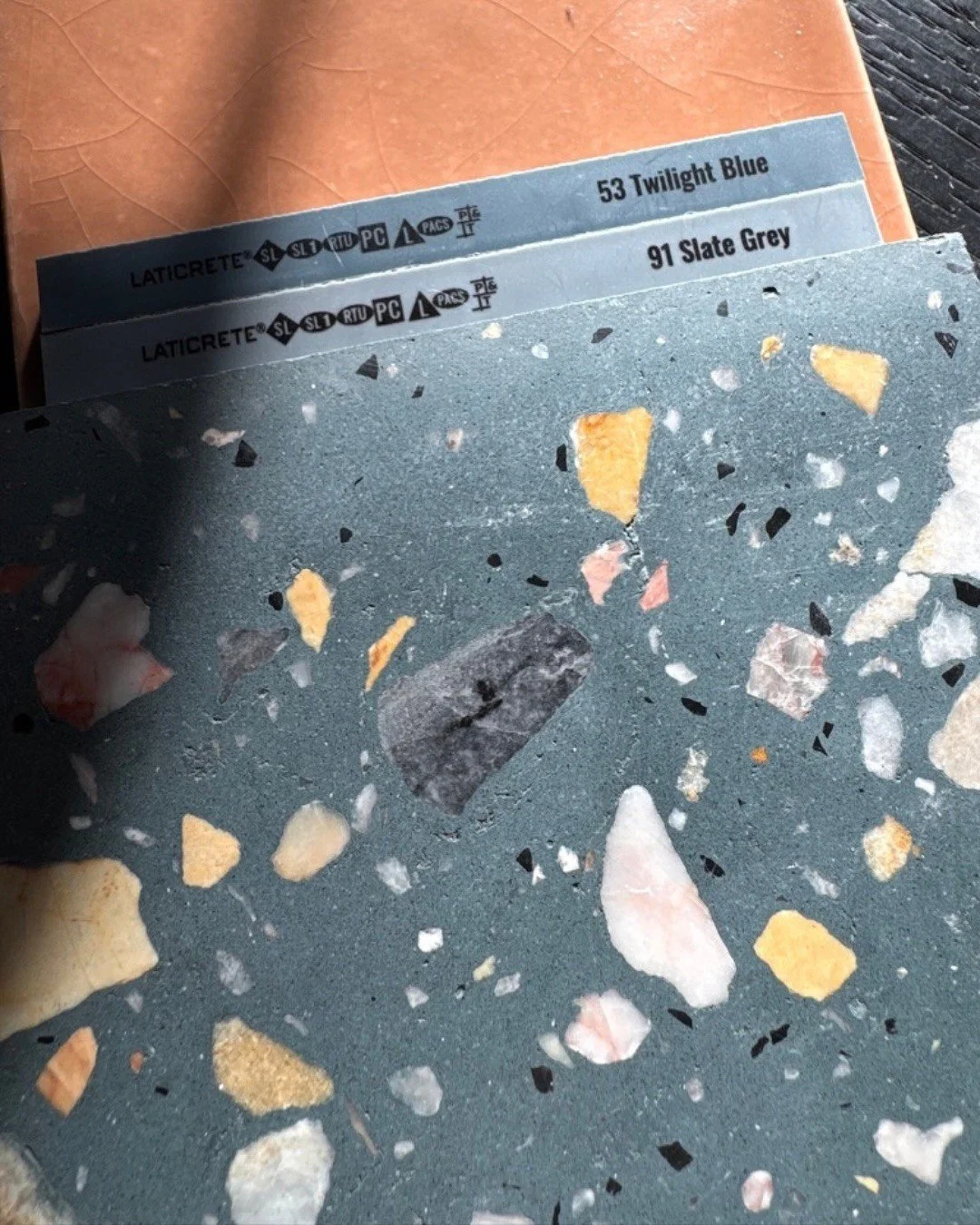 Blue-gray terrazzo sample with yellow and pale stone chips