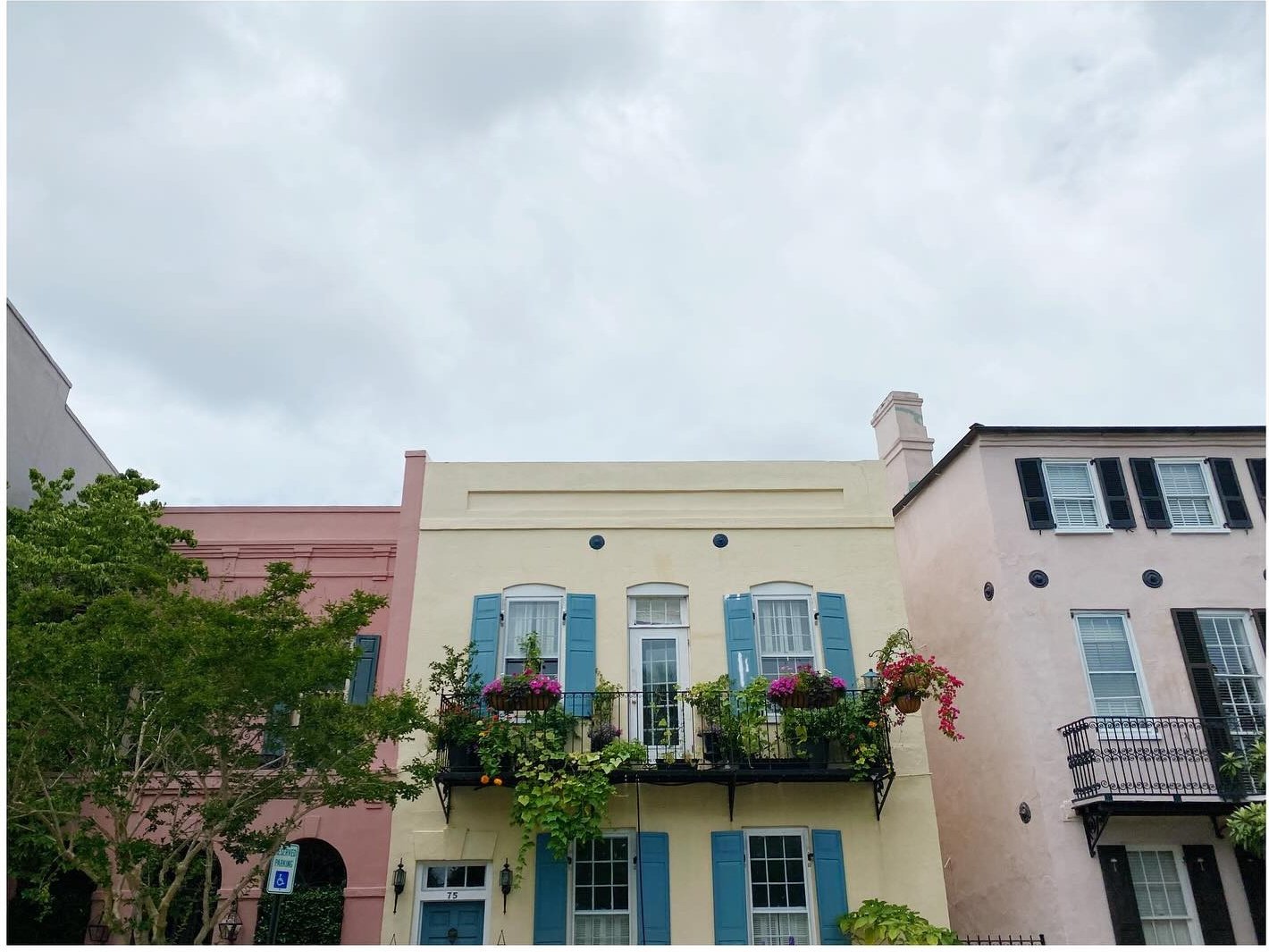 Yellow and pink historic facades with shuttered windows