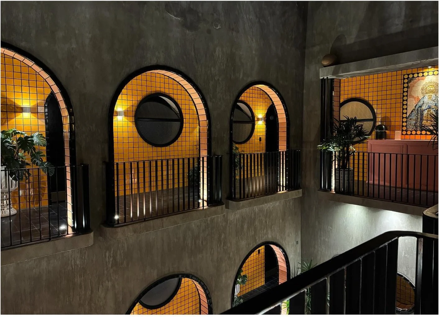 Arched balcony openings surrounding an interior courtyard